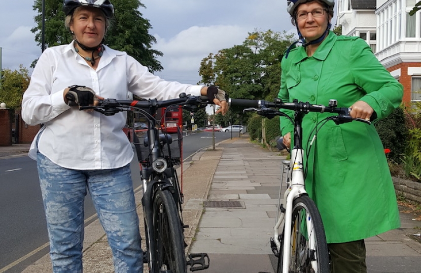 Karen Liebreich and Joanna Biddolph standing with bikes before setting off.