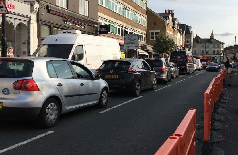 Turnham Green Terraced with traffic and bollards in September 2020