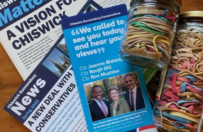 Three leaflets and two glass jars of rubber bands, saved to wrap round bundles of leaflets