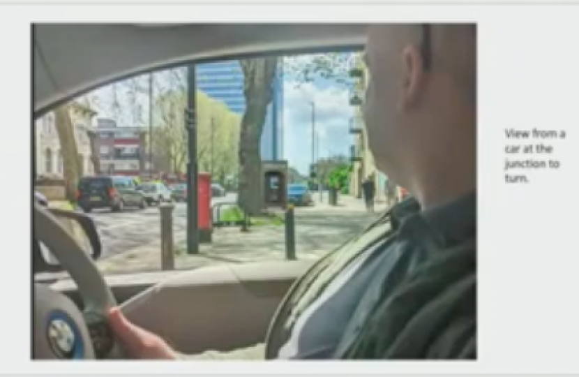 Photo of the residents' representative in his car showing the blocked view on leaving the car park if the advertising board were installed