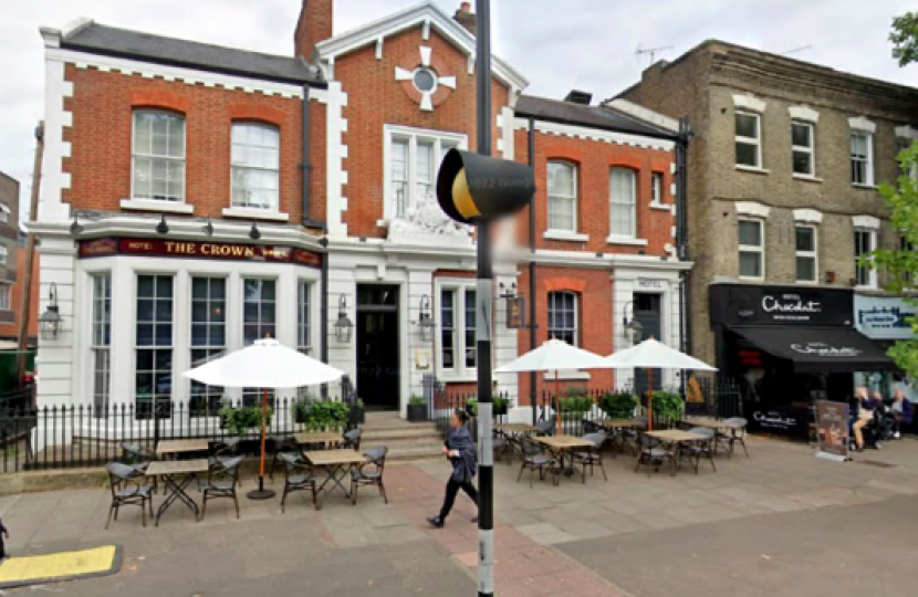 Photo of The Crown at 210 Chiswick High Road showing its outside tables and chairs