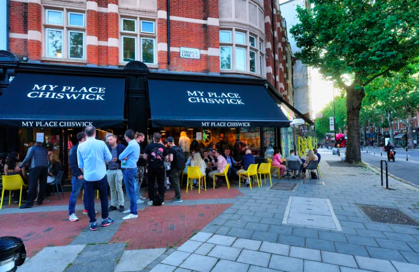 Front of My Place showing its awnings and people sitting at outdoor tables