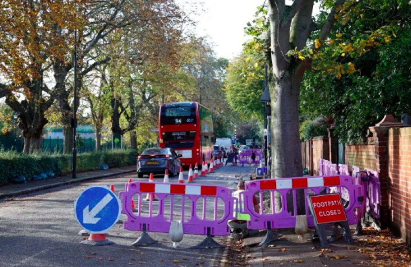 Photo of purple barriers closing one lane on South Parade and showing a queue or traffic in the other lane 