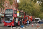 Buses and lorries stuck in gridlock at a floating bus island on Chiswick High Road