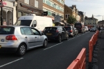 Turnham Green Terraced with traffic and bollards in September 2020