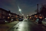 Photo of a dark residential street in the borough with current too low lighting levels.