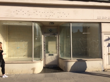 A pretty Art Deco shop completely empty, looking bleak