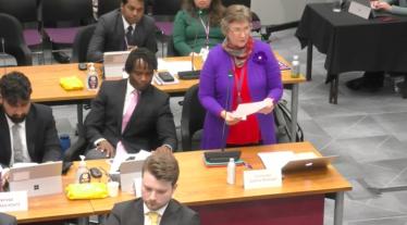 Cllr Joanna Biddolph standing to make her speech in the council chamber