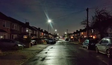 Photo of a dark residential street in the borough with current too low lighting levels.